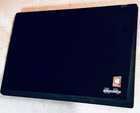 Black Lenovo ThinkPad P14S Gen 2 Touch 8-core Ryzen 7 Pro 5850U with visible rear camera, heat sinks, and printed specifications.