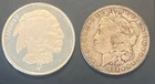 Asahi Buffalo round 1 oz Silver and an 1884 O Morgan Silver Dollar