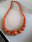 Vintage orange swirl large beads necklace Lucite?? with twist