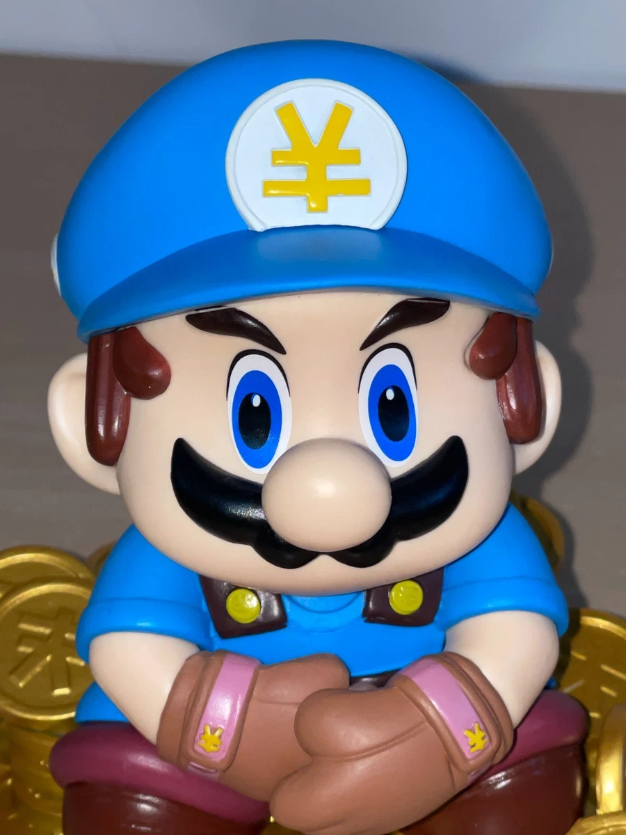 Figura Mario Bros sentada sobre Monedas Nintendo
