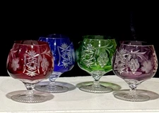 FOUR AJKA MARSALA MULTICOLOR LEAD CRYSTAL BRANDY GLASSES, 1980’s STICKER ON