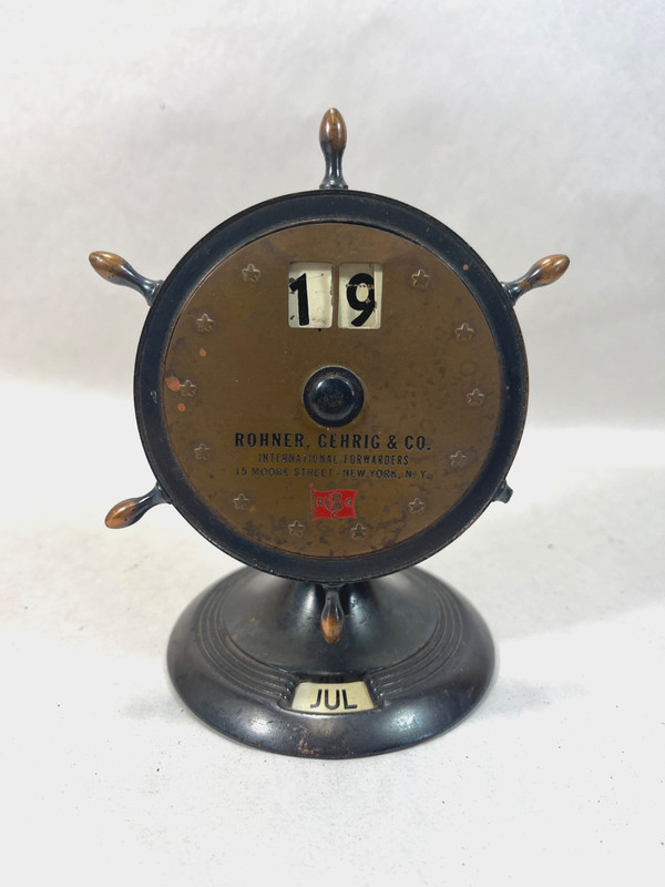 Vintage shipping company advertising ship wheel calendar