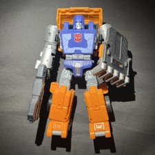 Transformers Huffer Kingdom Deluxe Class - Co...