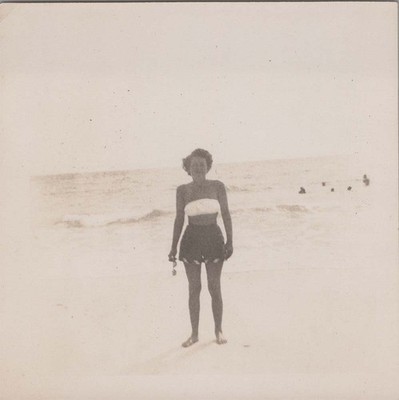 1950 Photo of Lady Standing Alone on Sandy Beach with Ocean Surf
