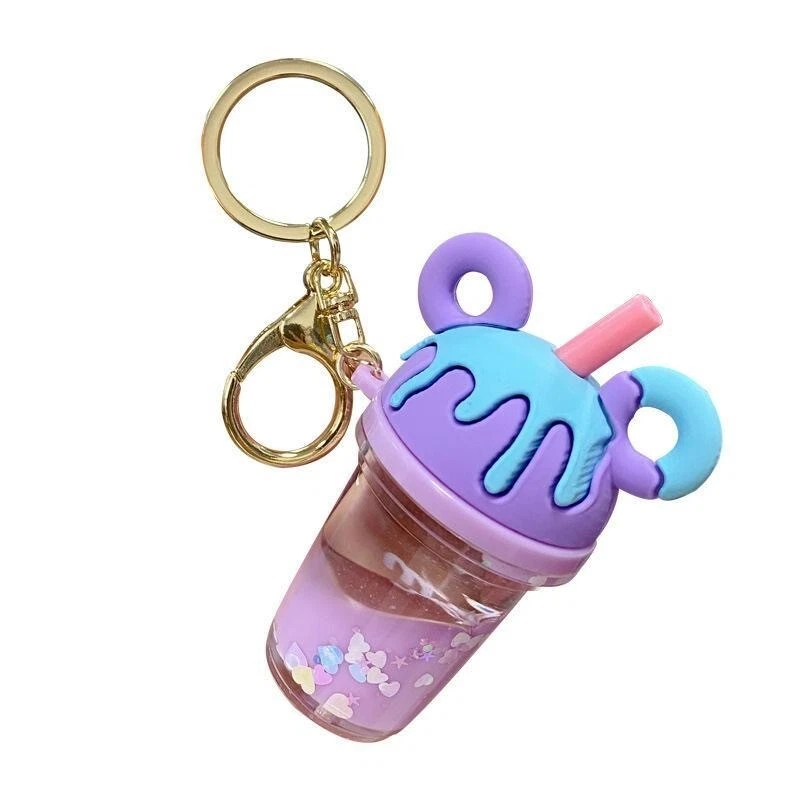 Lindo llavero de taza de té de leche de dibujos animados con líquido flotante - Perfecto para parejas Foto 4 de 4