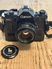 Canon A-1 + Pro Kit with Motor Drive MA + 50mm 1.8 - 1980 Olympics Cap