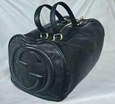 Stunning Black Gucci barrel shaped leather hand bag with tassel