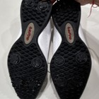 White leather FootJoy LoPro women’s golf shoes with black wingtip lace up, US 8M, shown from below with red logo and text.