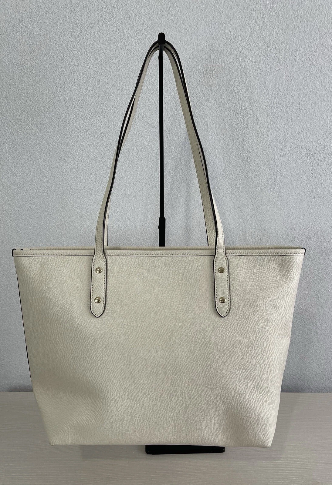 Borsa Coach City con zip e rivetti in cristallo polvere di stelle