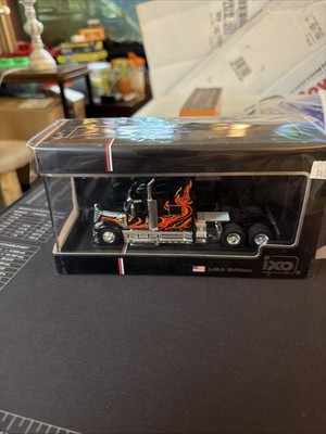 IXO MODELS U64TR008 1:64 2010 INTERNATIONAL LONESTAR - BLACK WITH FLAMES
