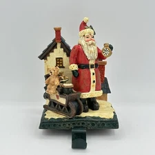 Holiday Home Christmas Stocking Hanger Santa Holding Clock With Sleigh Toys Bear
