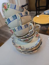 Set Of Six Hand Painted Coffee Cups With Saucers. With Gold Trim.