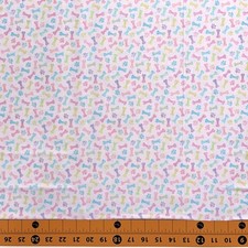 Fabric Traditions Pastel Dog Bone Paw Print Toss Pink YARD