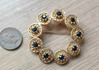 GORGEOUS VINTAGE CIRCULAR BROOCH WITH STONES