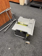 RYOBI 15 Amp 10 in. Table Saw with Folding Stand Powerful Saw  with extra blades