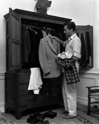 Dirk Bogarde sorting out some of the clothes for trip to Venice 1950s Old Photo