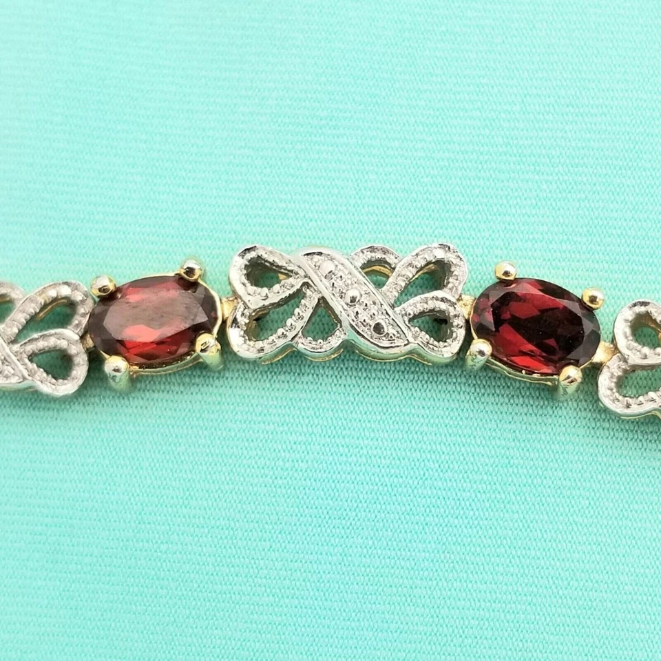 Brazalete de tenis con cuentas de granate simulado de corte ovalado de 8 quilates en acabado de oro de plata 925 Foto 3 de 4