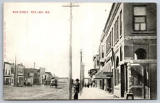 Rice Lake Wisconsin~Main Street~Barber & Baths~c1910 Postcard