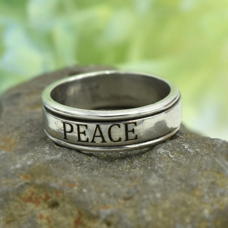 Peace spinner ring deals