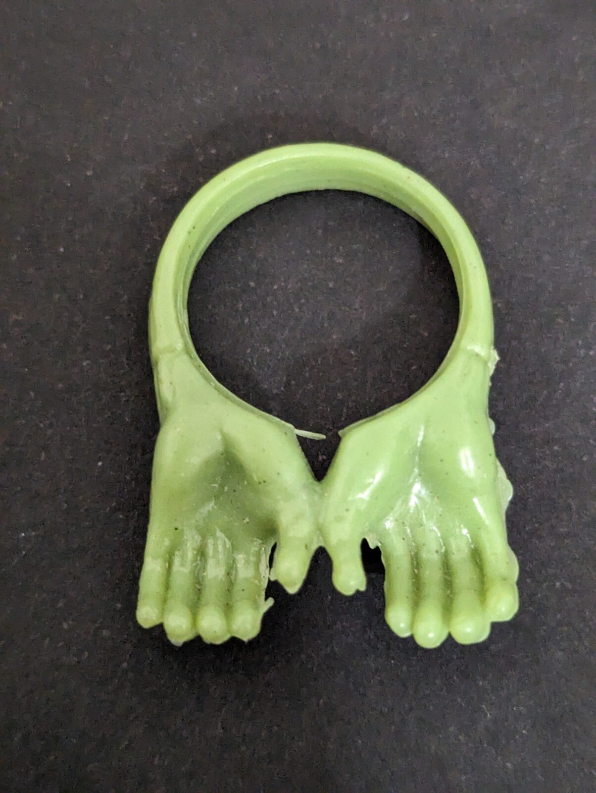 What is this small, old, hard plastic toy from a cereal or Cracker Jack box