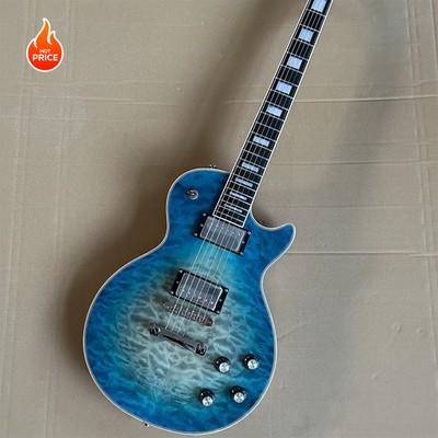 A Sleek Solid Body Electric Guitar with a Cool Blue Sunburst Finish Fixed Bridge