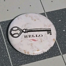 1" Round Metal Vintage Pin Hello Antique Key Graphics Selizergoods Company