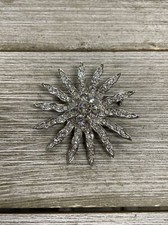Silver Toned Embellished Star Burst Brooch