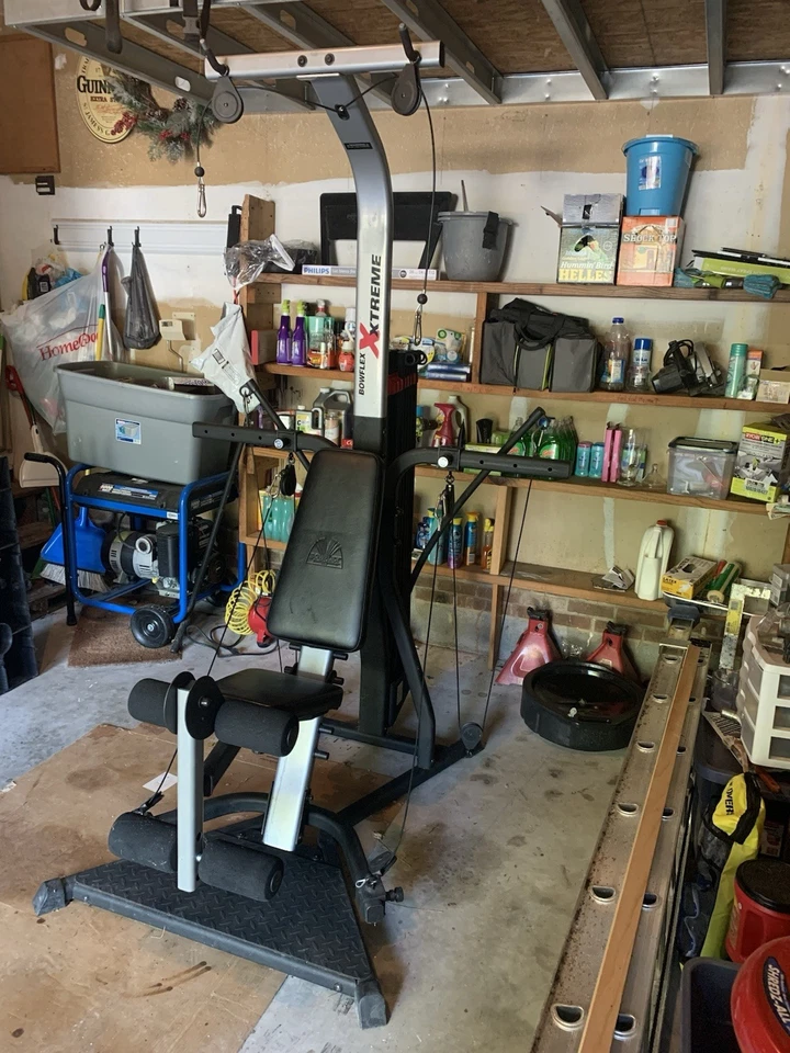 The Bowflex Xtreme Home Gym, 310 Lbs of Resistance, Squat, Curl, And Lat Bars - Image 4 of 4