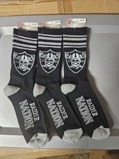 3 Pairs Of Las Vegas Raiders 4 Stripe Deuce crew socks.