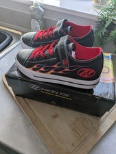 Boys snazzy black and red heelys size 1