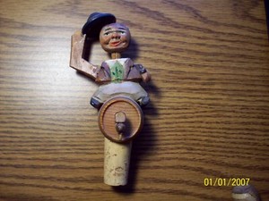GERMAN HAND CARVED WINE CORK STOPPER. MAN TIPPING HAT  SITTING ON BEER KEG