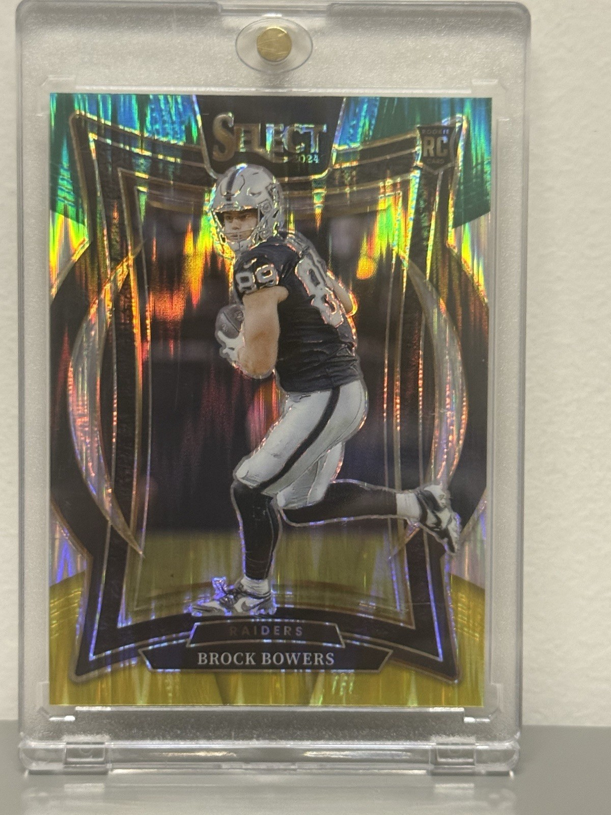 2024 Panini Select - Concourse Brock Bowers #31 Green & Yellow Shock Prizm (RC)