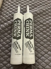 Two tubes of New Perma-Chink Log Home Sealant.