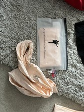Ballet package of capezio shoes, tights, black leotards and ballet bag.