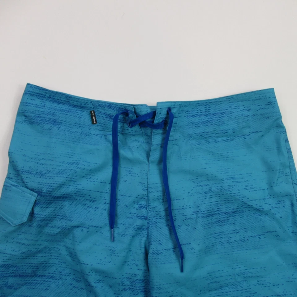 Pantalones Cortos Oakley Para Hombre Talla 33 Azul Bolsillo Botón Ligeros Aire Libre Playa Foto 2 de 4