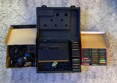 Atari 2600 Console Bundle. Comes with 4 controllers, 2 paddles, and 40+ games.
