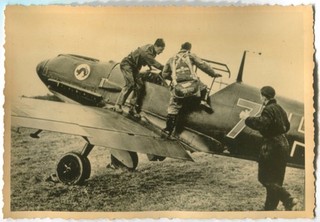 WWII ARCHIVE PHOTO: LUFTWAFFE PILOT STEPPING IN MESSERSCHMITT BF 109 COCKPIT