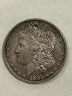 1885 U.S. Morgan Silver Dollar.  Holed Buy for 50% of melt value.