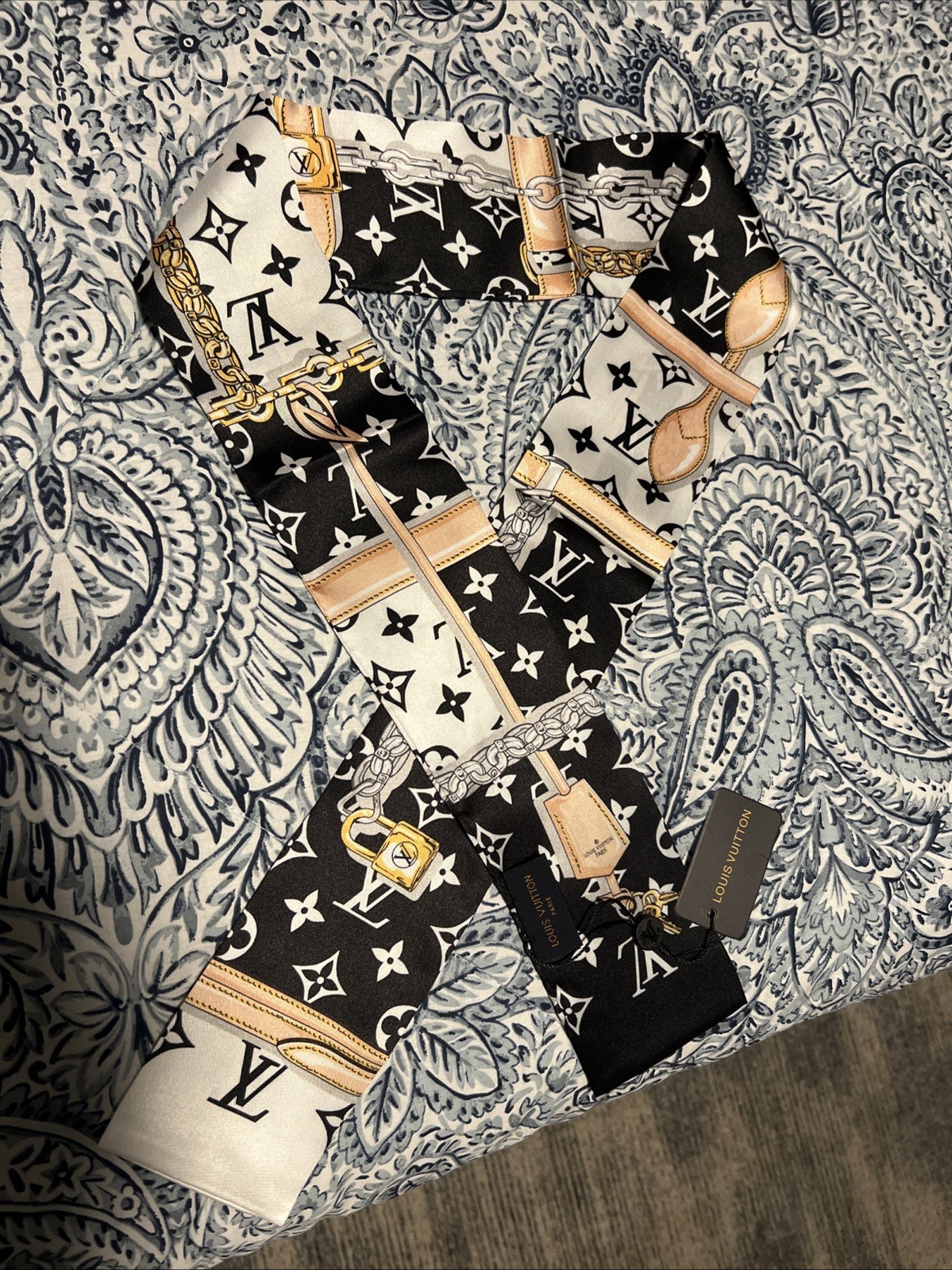 Louis Vuitton luxury silk twilly scarf for elegant styling-image