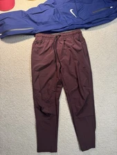 Nike Athletic Unlimited Tapered Leg Versatile Size M Burgundy Joggers Tech Light