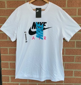 white pink and blue nike shirt