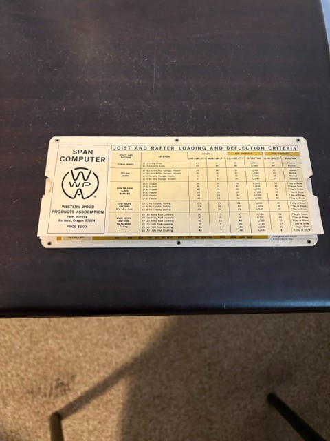 A paper 'Beam Span Computer' slide rule is a beautifully weird single-purpose analog calculator — proof that there was a slide rule for everything.