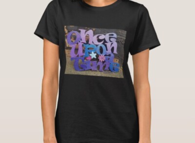 Once upon a time T-shirt, purple blue colour theme, brick wall background.