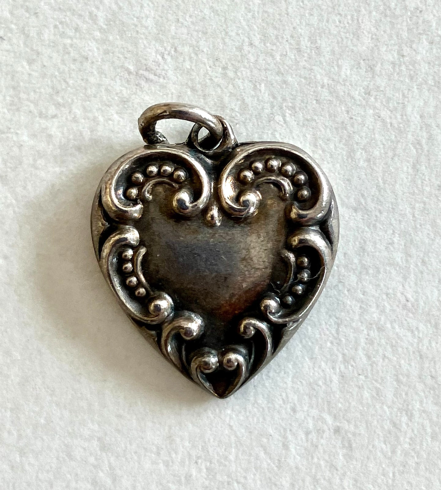 Sterling silver vintage charm, puffy heart, antique (dent)