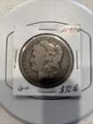 1897O Morgan. Grade Good? Nice old semi rare silver coin.