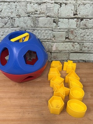 Tupperware Shape-O-Ball Red & Blue Shape Sorter with 10 Yellow Geometric Shapes