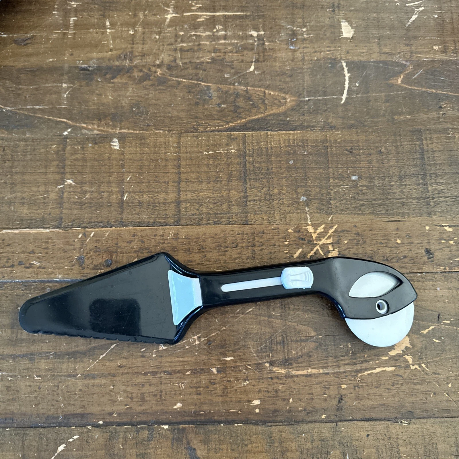 The Broadway Emporium Weinstocks Pizza Cutter Advertising