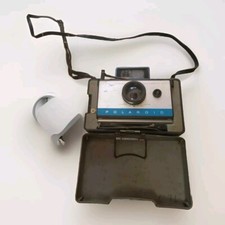Macchina fotografica terrestre Polaroid vintage automatica 125 pieghevole non testata