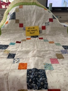 23 X 29 WALL HANGING QUILT IN LIGHT COLORS DESIGNED BY GEORGIA NORRIS