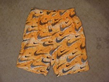 EUC Nike Swim Trunks Yellow Black Swoosh Size Youth Large